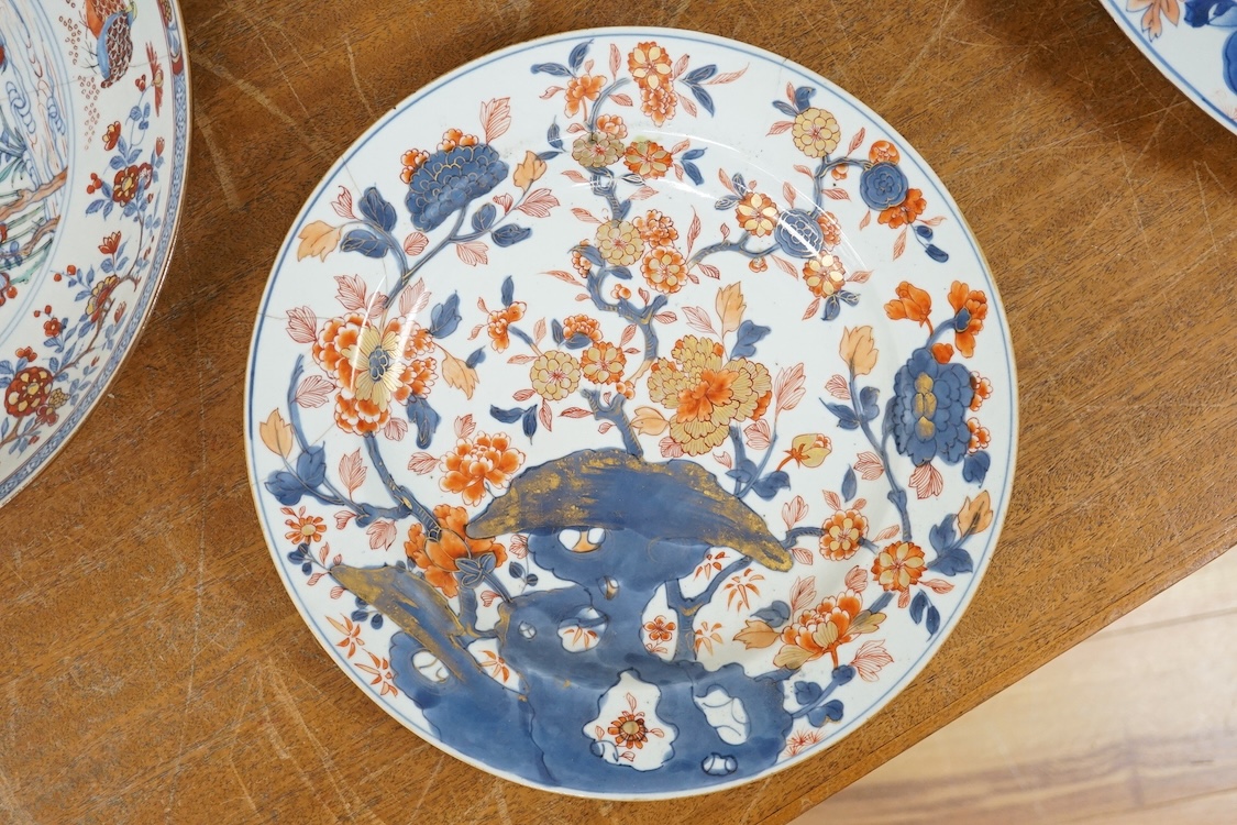 Three early 18th century Chinese Imari dishes (one clobbered), largest 46.5cm, together with a 19th century Chinese powder blue ground vase, 44cm high and a horn carving, 13.7cm (5)